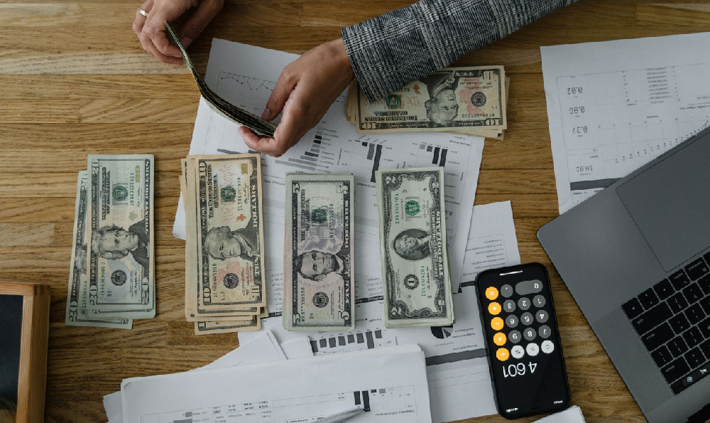 How do debt collection agencies operate, and how do they profit?
